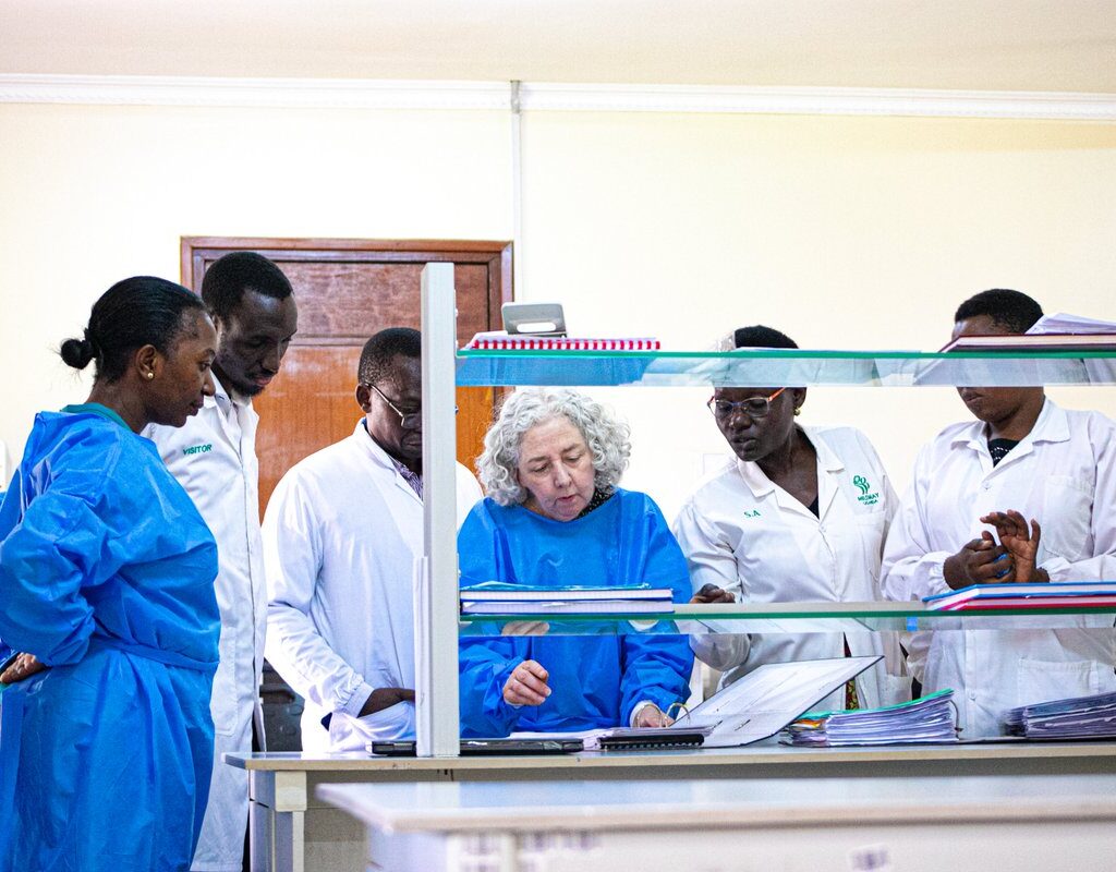 Laboratory team with visitors